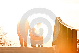 Silhouette of pedestrians on bridge in freiburg