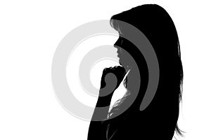 Silhouette of a pensive woman on a white background