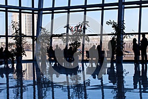 Silhouette of people in a business center