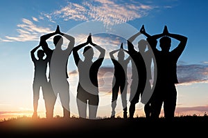 Silhouette Of People Doing Yoga