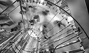 Silhouette people on glass staircase, view from the bottom.Business concept