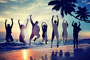 Silhouette People Jumping with Excitement on a Beach photo