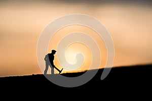 Silhouette people mining on sky sunset background.