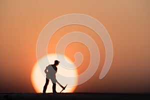 Silhouette people mining on sky sunset background.