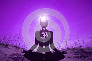 Silhouette of a person doing yoga with the root chakra symbol