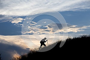 Silhouette of person heavy walking toward the