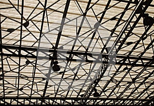 Silhouette photo of metal structure on the roof which shows beautiful pattern of row and branches of abstract art with clear