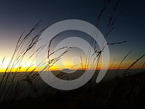 Silhouette photo at sunrise on Mount Merbabu