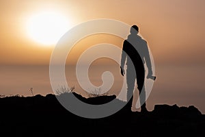 Silhouette of photographer above the inversion