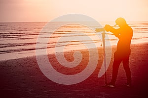 Silhouette of Photographer, Man using monopod