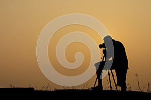 Silhouette photographer With the morning atmosphere