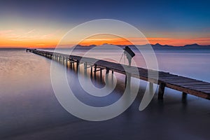 Silhouette of a photographer on pier, Alcudia