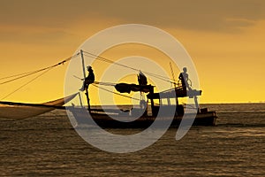 Silhouette photography of domestic fishery boat in trad eastern of thailand