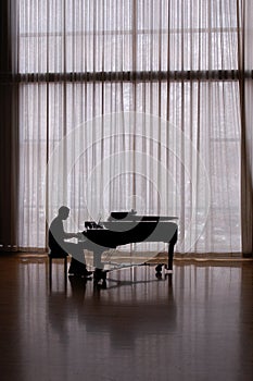 Silhouette pianist photo