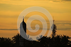 Silhouette picture of Masque in Golden Sky - Sunset - Evening Sun in full orange color