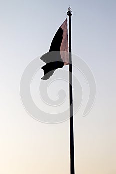 Silhouette picture of Pakistan nation flag at Wagha Border in Punjab.