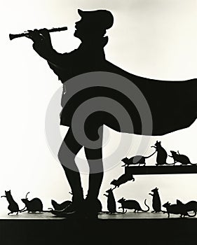 Silhouette of Pied Piper followed by rats