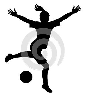 Silhouette of playing women's football schoolgirl who jumps up preparing to kick the ball with her foot