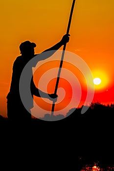 Silhouette of Poler in Okavango Delta