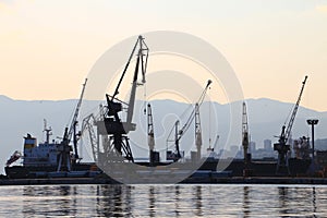 Silhouette of port cranes and ships, harbor of Rijeka, Croatia