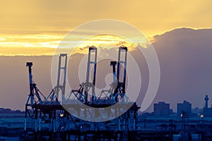 Silhouette harbor industrial transportation dock with crane and shipment for global business and comercial concept. photo