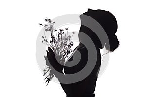 Silhouette portrait of a beautiful girl with a bouquet of with dandelions on a white isolated background