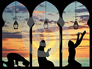 Silhouette of praying Muslims