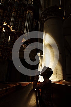 Silhouette of praying woman