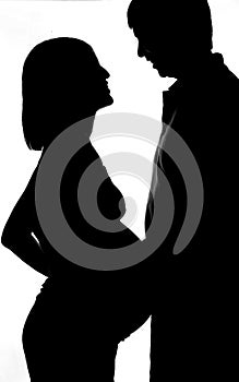 Silhouette Of Pregnant Woman With Her Husband
