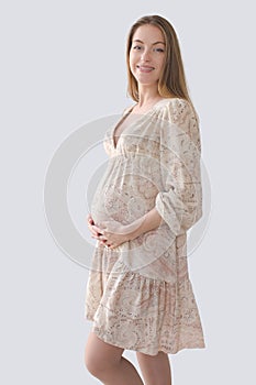 Silhouette pregnant woman holding her belly