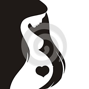 Silhouette of a pregnant woman with long hair