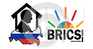 Silhouette of the President of Russia Vladimir Putin in the house on the map of Russia and the logo of the BRICS summit 2023