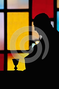 Silhouette of priest photo