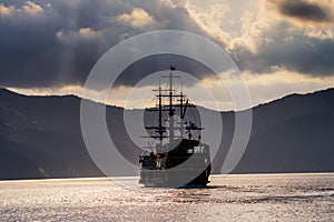 Silhouette prirate tourist ship sailing on Ashi lake