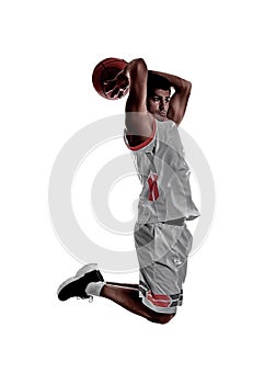 Silhouette of professional sportsman playing basketball on white background