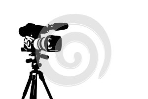 Silhouette of professional video camera.