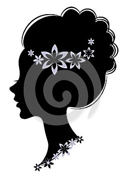 Silhouette profile of a cute lady s head. The girl has long beautiful hair, decorated with purple flowers. Suitable for