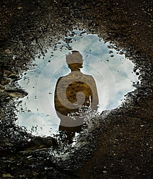 Silhouette and puddle photo