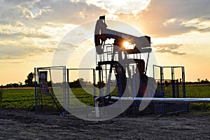 Silhouette of a Pumpjack during dusk time