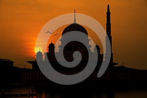 Silhouette of Putrajaya red mosque during sunrise in Malaysia