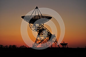 Silhouette of radar dishes