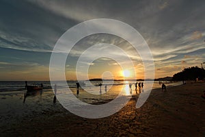 Silhouette and reflection of boat and people against the sunset sky sunset sky