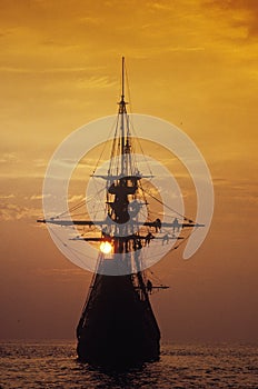 Silhouette of a replica of the Mayflower photo