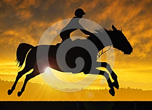 Silhouette of a rider on a running horse