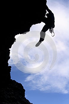 Silhouette of a rock climber