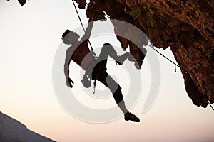 Silhouette of a rock climber