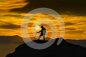 Silhouette of a rock climber on the peak. Sport and active life concept