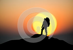 Silhouette of a rock climber