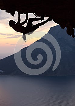 Silhouette of a rock climber at sunset