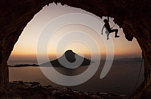 Silhouette of a rock climber at sunset